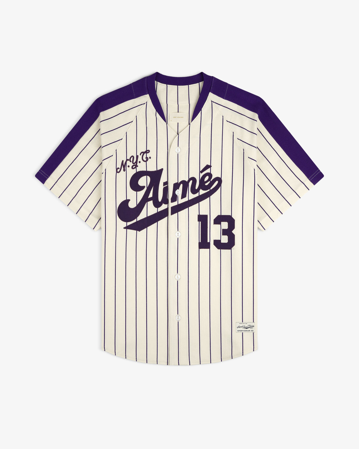 Aimé Baseball Jersey: Ivory with navy pinstripes, 13, Aimé script, and purple shoulders and trim.