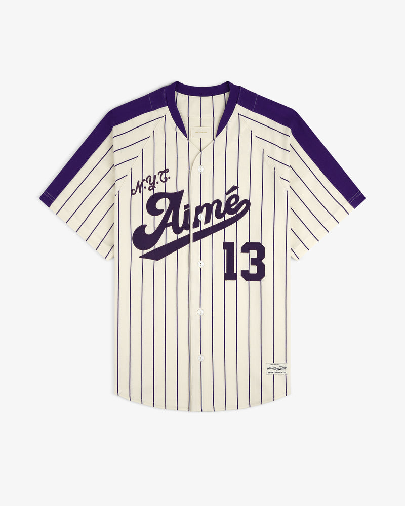 Aimé Baseball Jersey: Ivory with navy pinstripes, 13, Aimé script, and purple shoulders and trim.