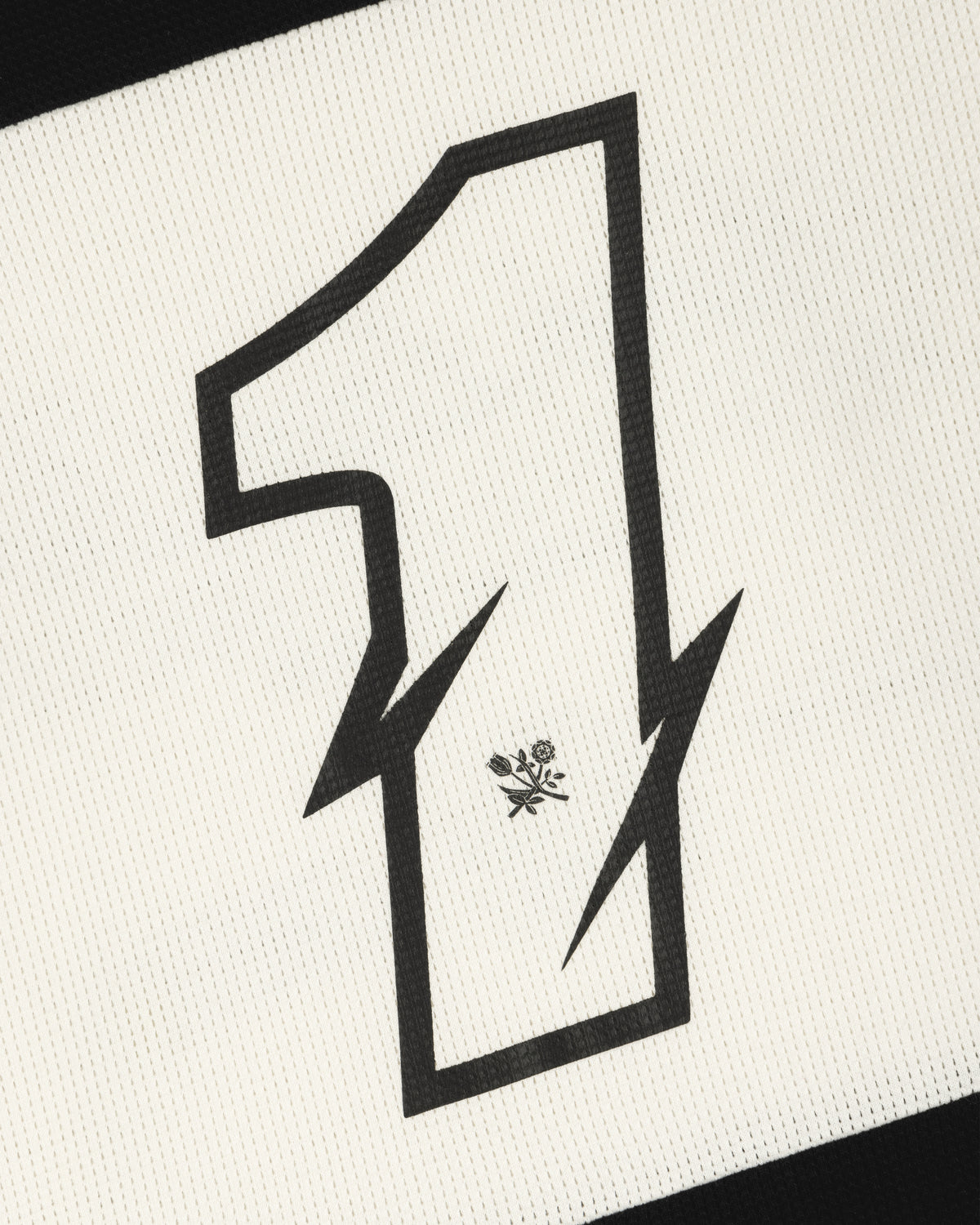 A bold black number 1 with lightning edges and a flower emblem decorates this Long-Sleeve Mesh Enduro Tee.