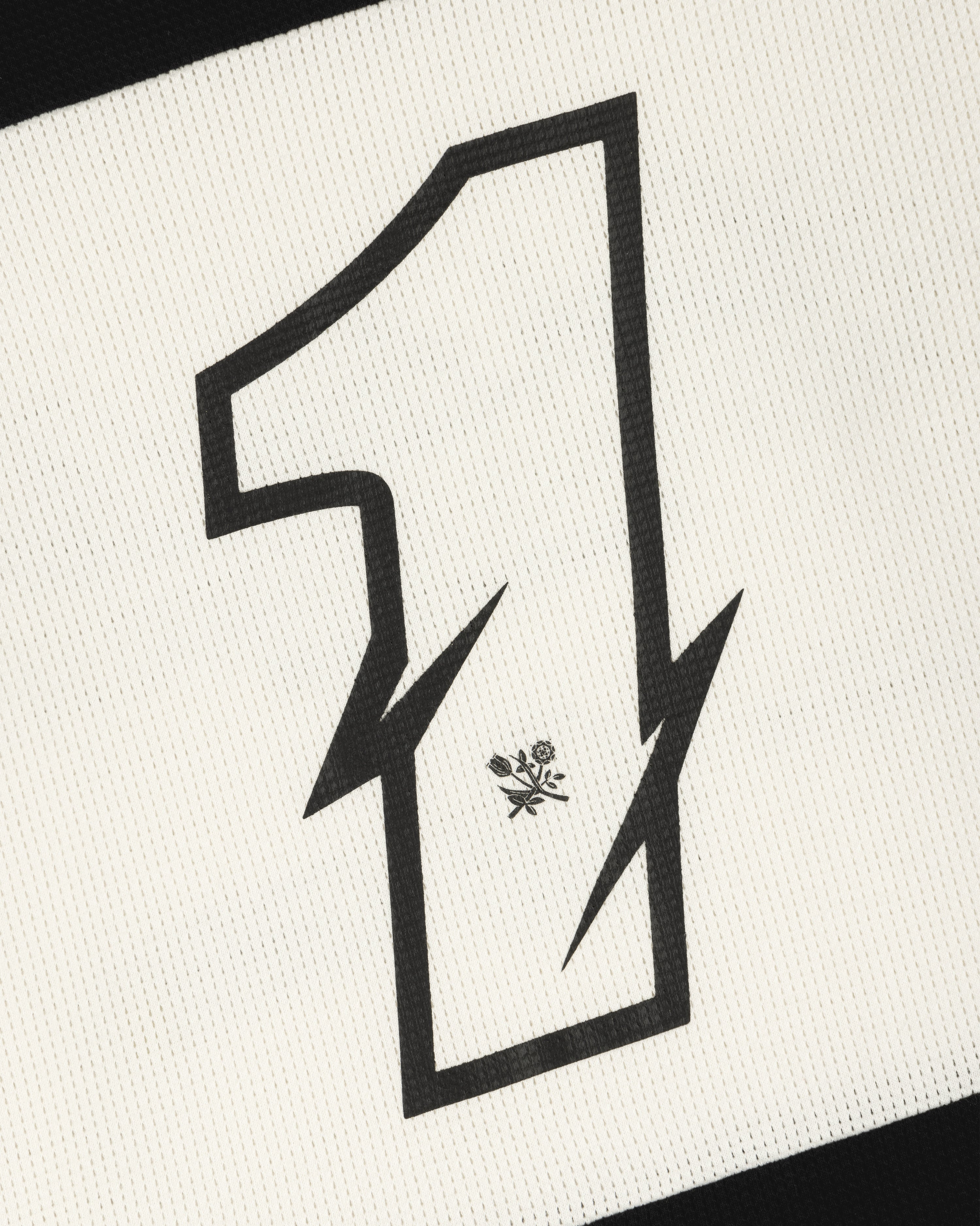 A bold black number 1 with lightning edges and a flower emblem decorates this Long-Sleeve Mesh Enduro Tee.