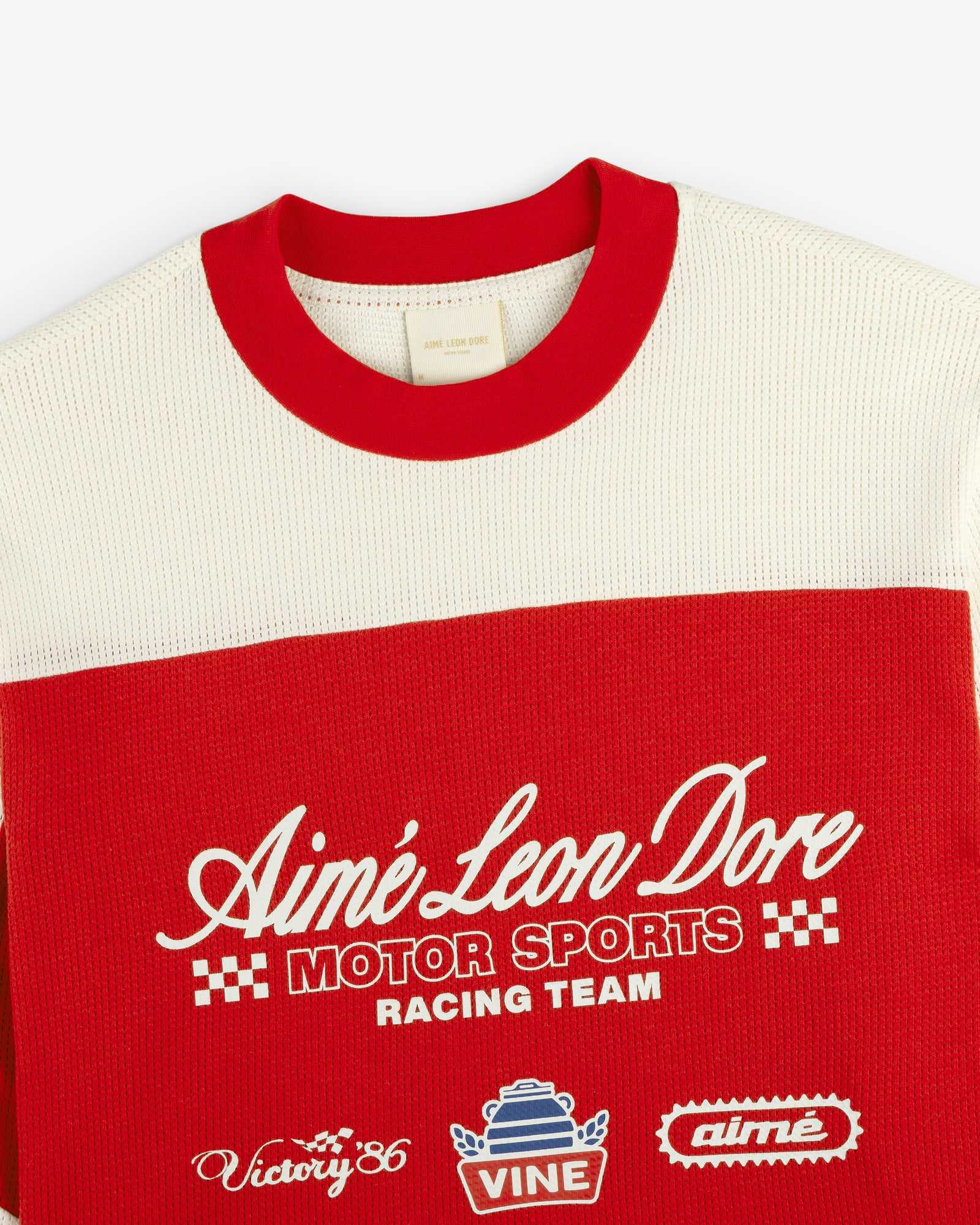 Red and cream Long-Sleeve Mesh Enduro Tee by Aimé Leon Dore with embroidered logos and checkered front accents.