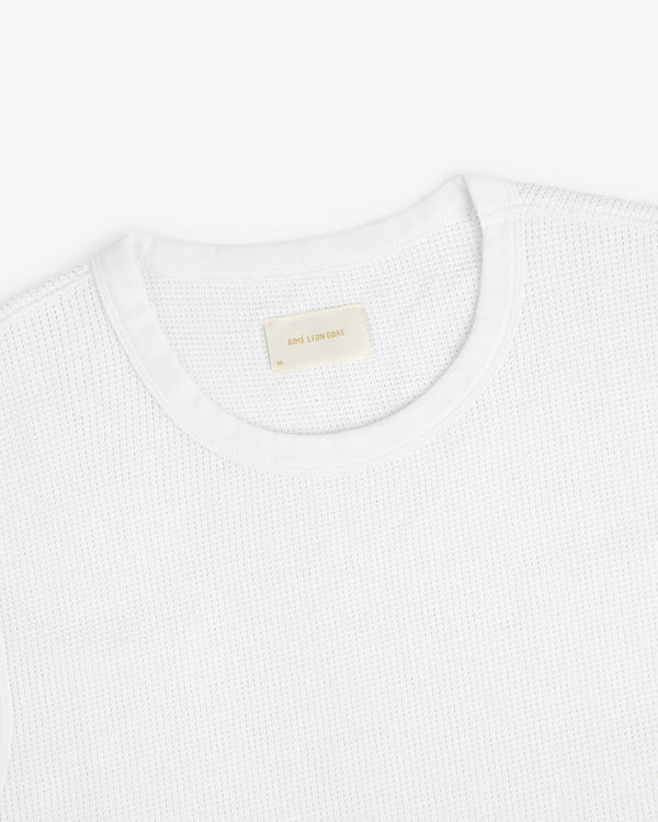 Mesh Muscle Tank shown on a white background with a beige label sewn inside the collar.