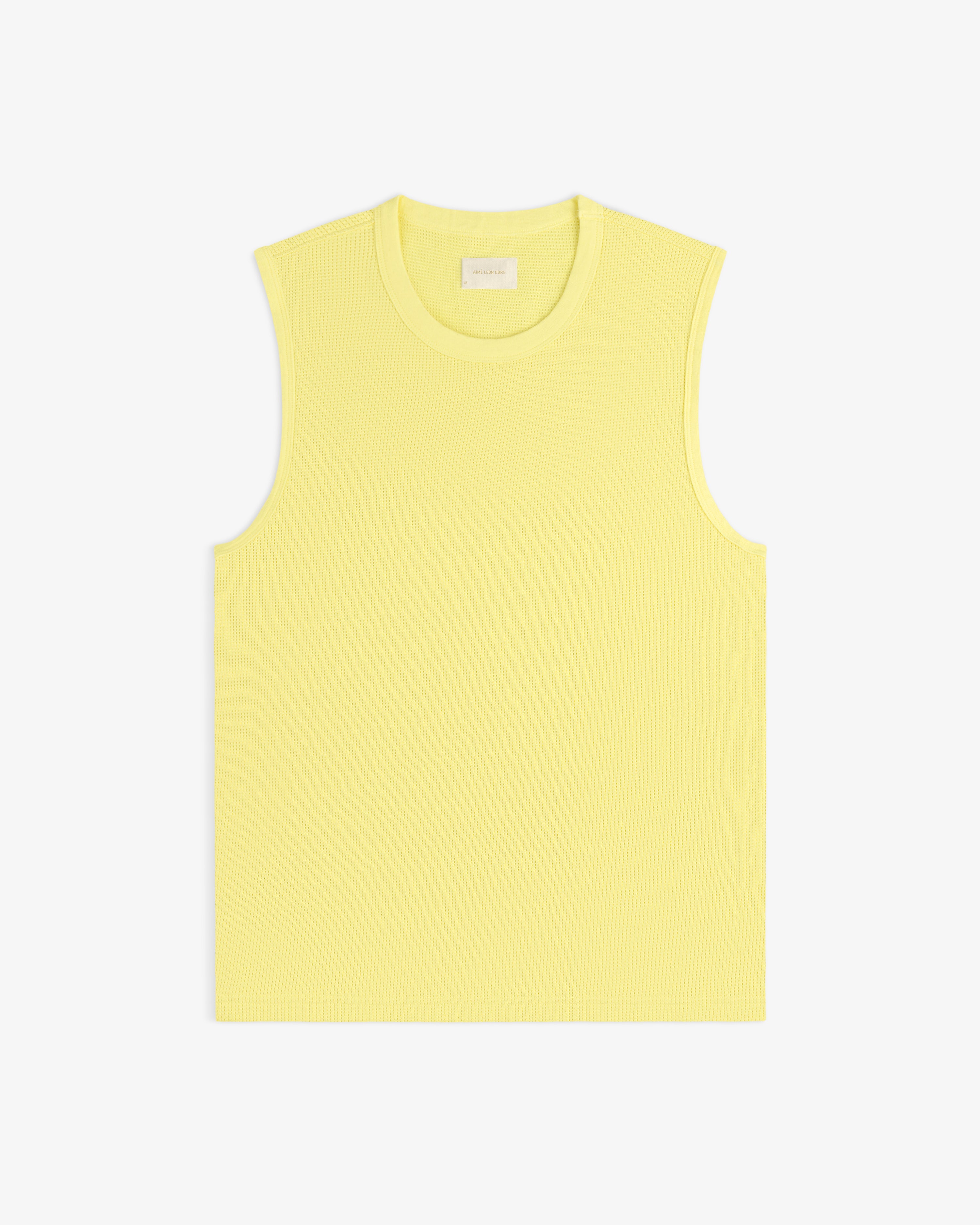 Mesh Muscle Tank in yellow, sleeveless and ribbed, displayed flat on a white background.
