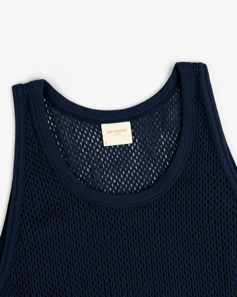 Mesh Tank Top in navy blue with a white neckline label, displayed flat on a white background.