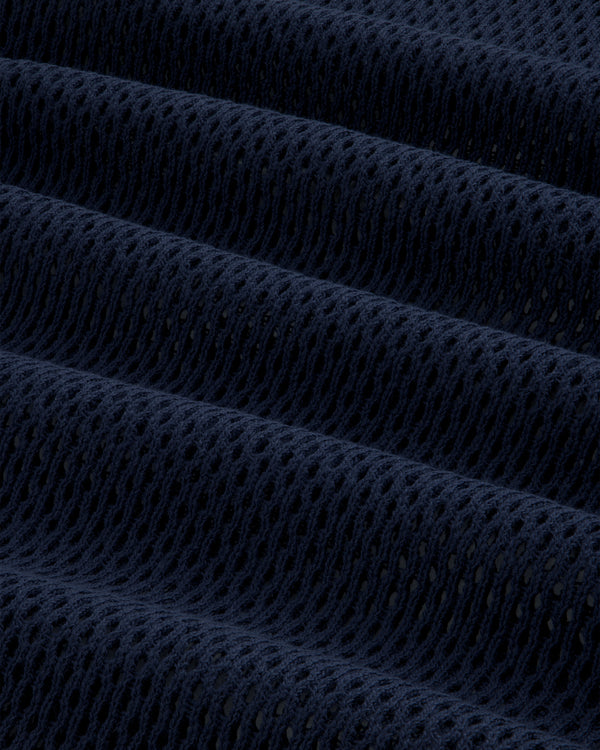 Close-up of the Mesh Tank Top's dark blue, textured mesh fabric with evenly spaced holes and soft folds.