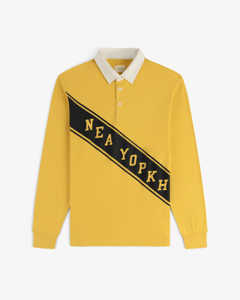 Vintage Slub Rugby: Yellow long-sleeve polo with white collar and NEA YOPKH on a black diagonal stripe across front.