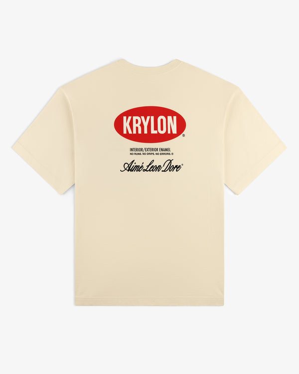 Krylon Logo Tee: beige t-shirt with red KRYLON logo front and black Aimé Leon Dore script on back.
