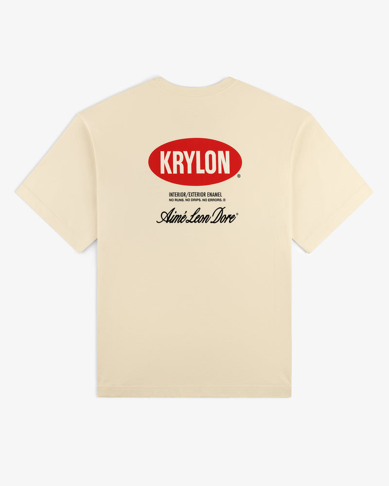 Krylon Logo Tee: beige t-shirt with red KRYLON logo front and black Aimé Leon Dore script on back.