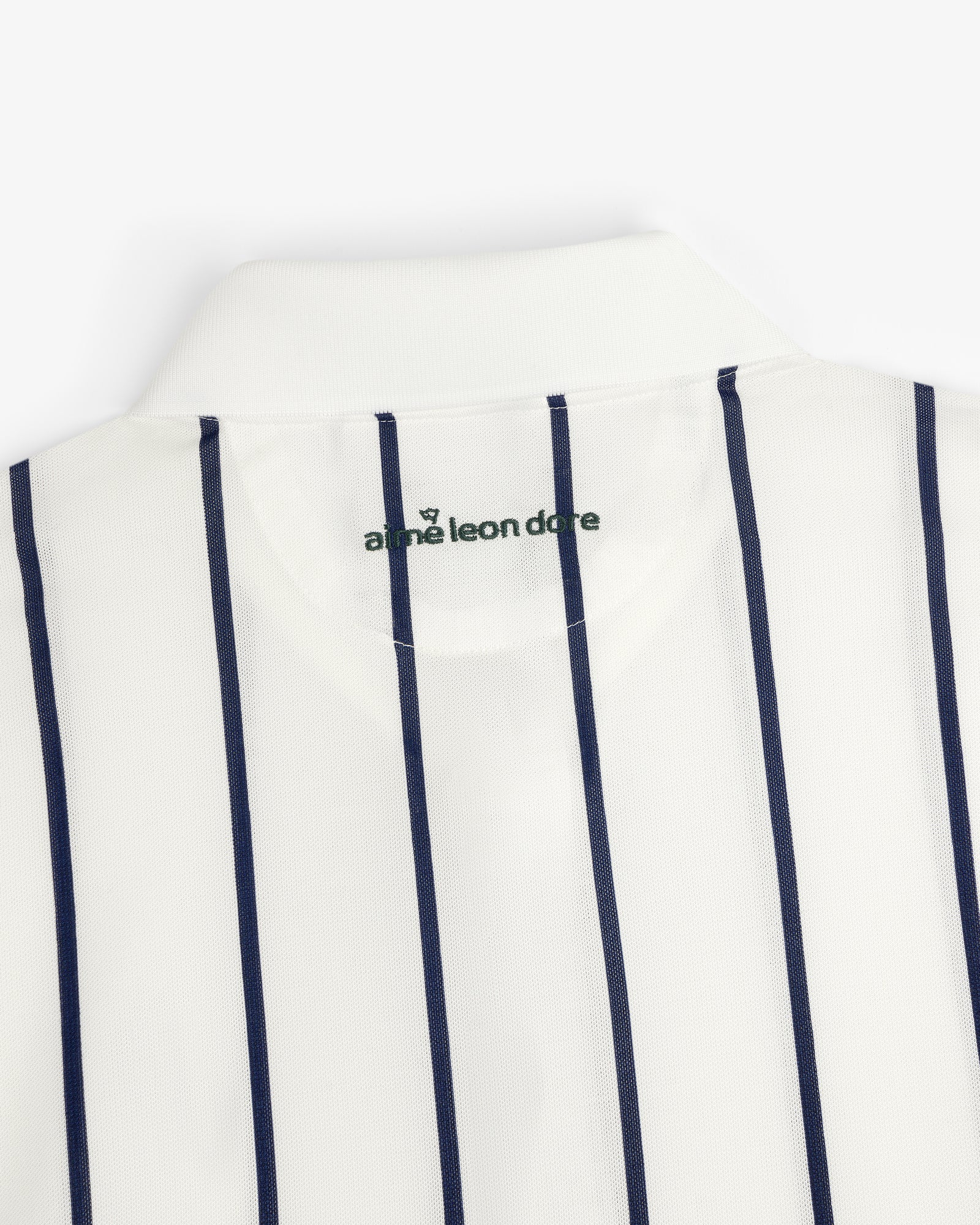 ALD Golf Polo: White collared shirt with vertical navy stripes and logo inside the neck.