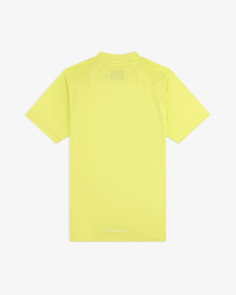 Back view of the ALD Golf Performance Tee, a light yellow short-sleeve shirt with mesh shoulder panels.