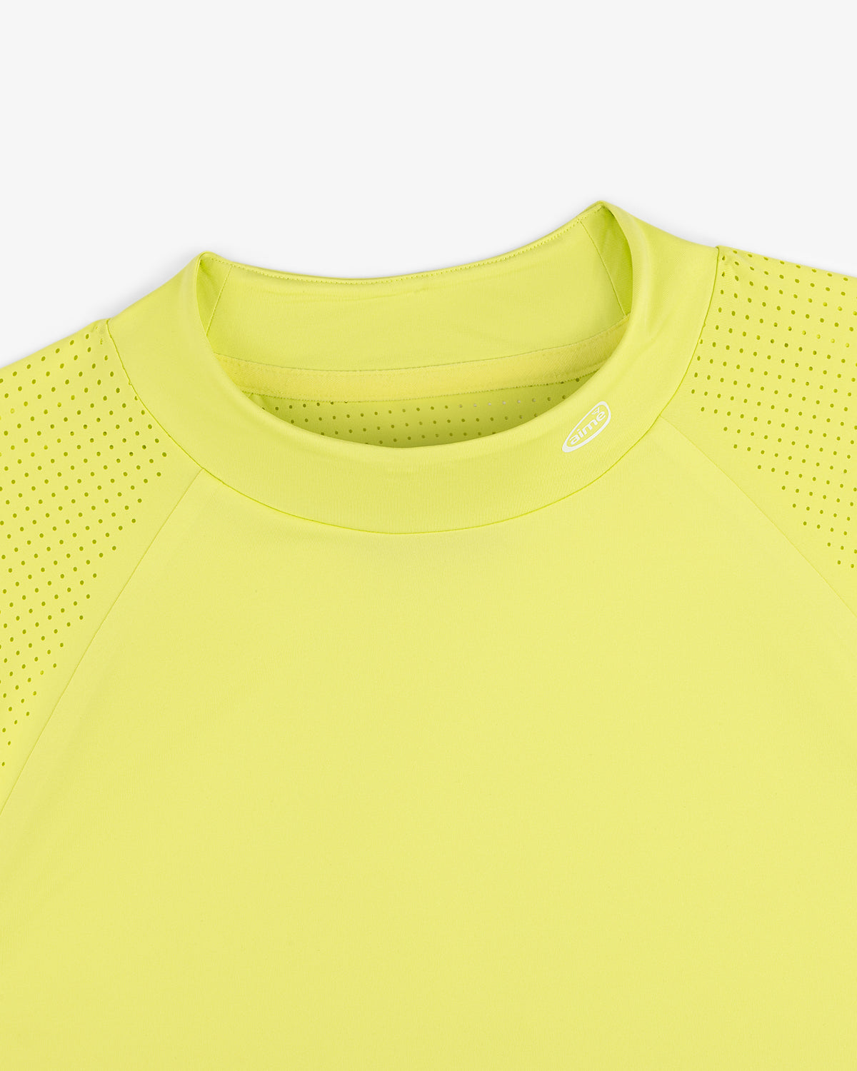 ALD Golf Performance Tee in bright yellow with perforated sleeves, shown neck down on a white background.