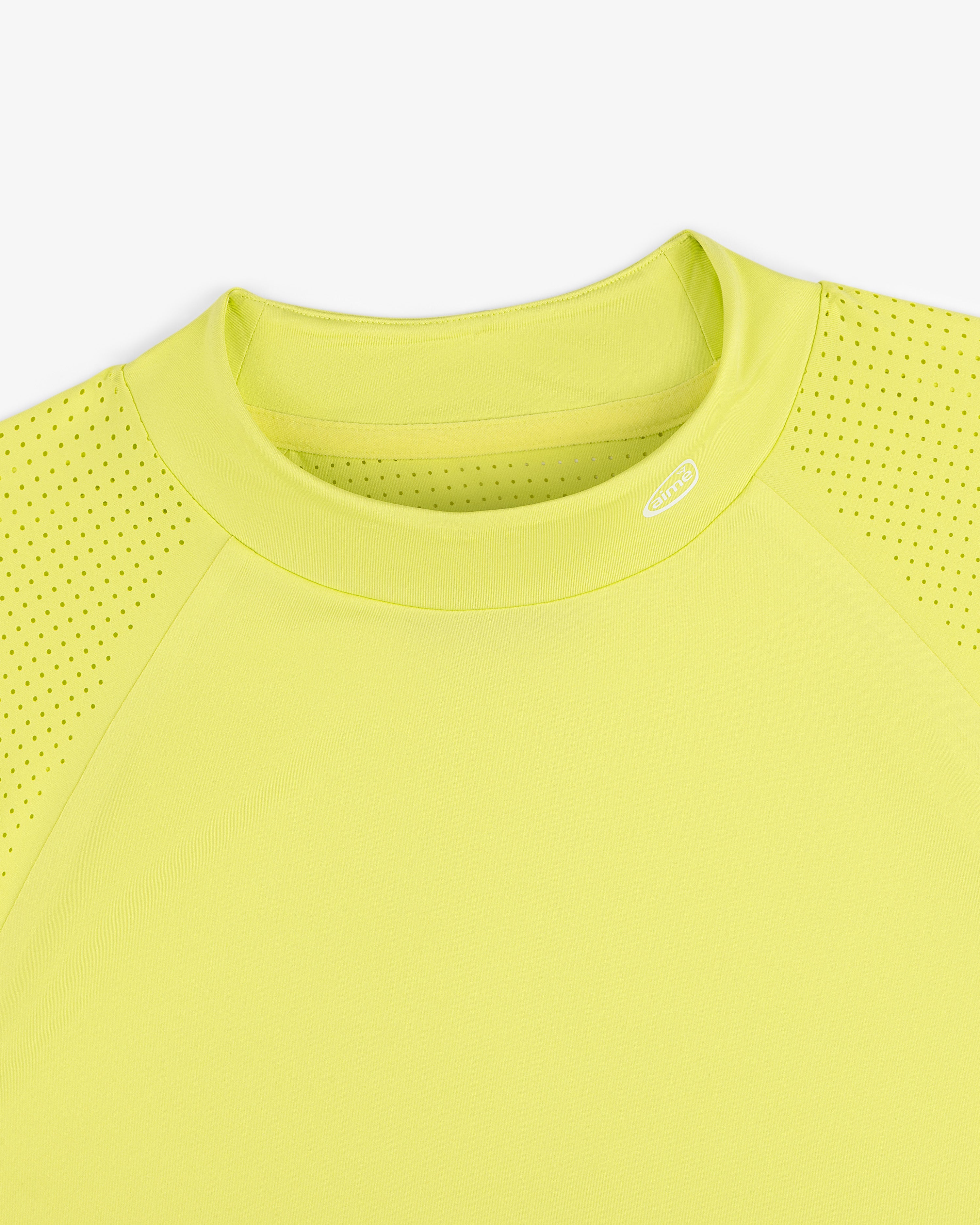 ALD Golf Performance Tee in bright yellow with perforated sleeves, shown neck down on a white background.