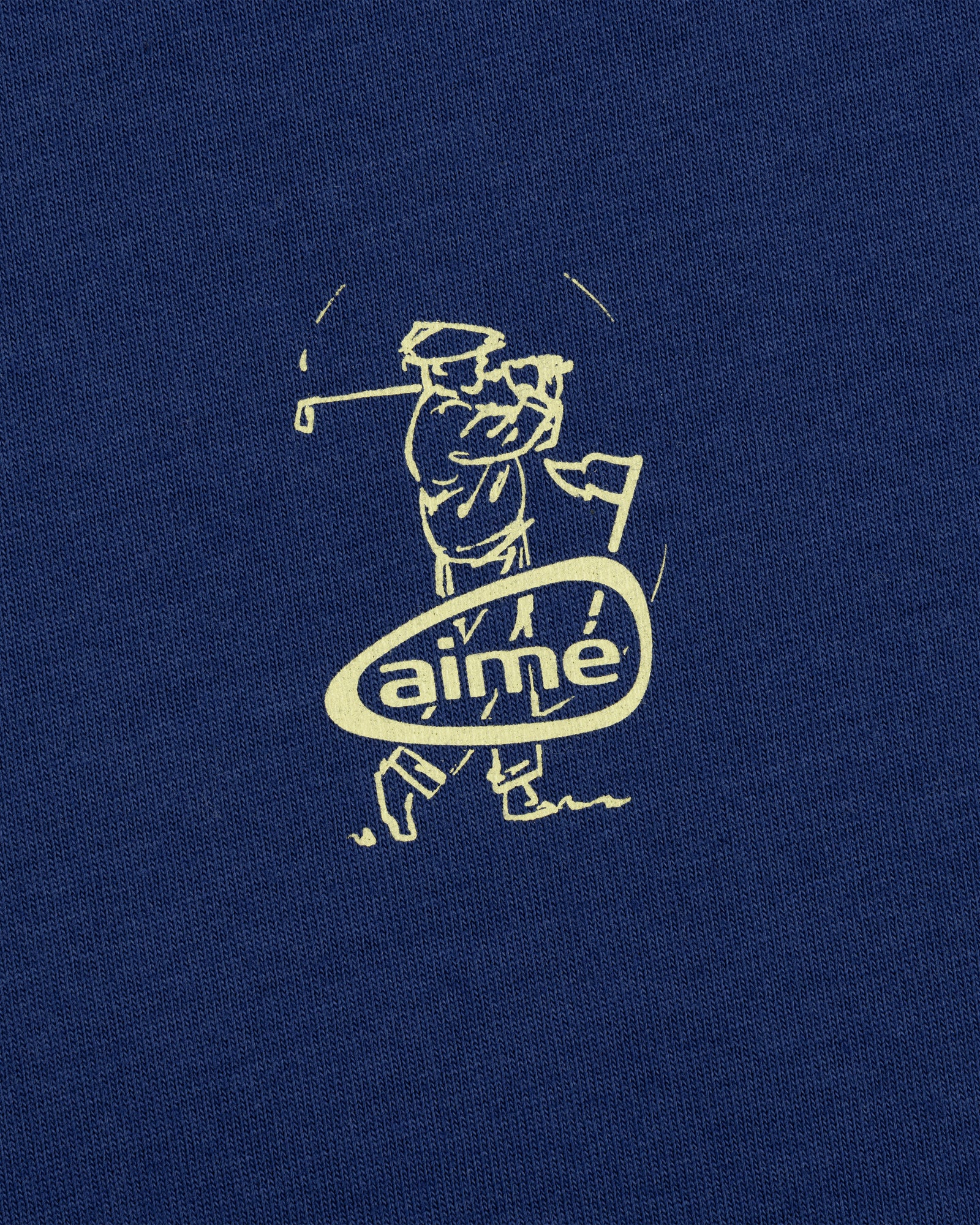 Line drawing of a golfer swinging a club above "aime" on blue ALD Golf Swing Tee.
