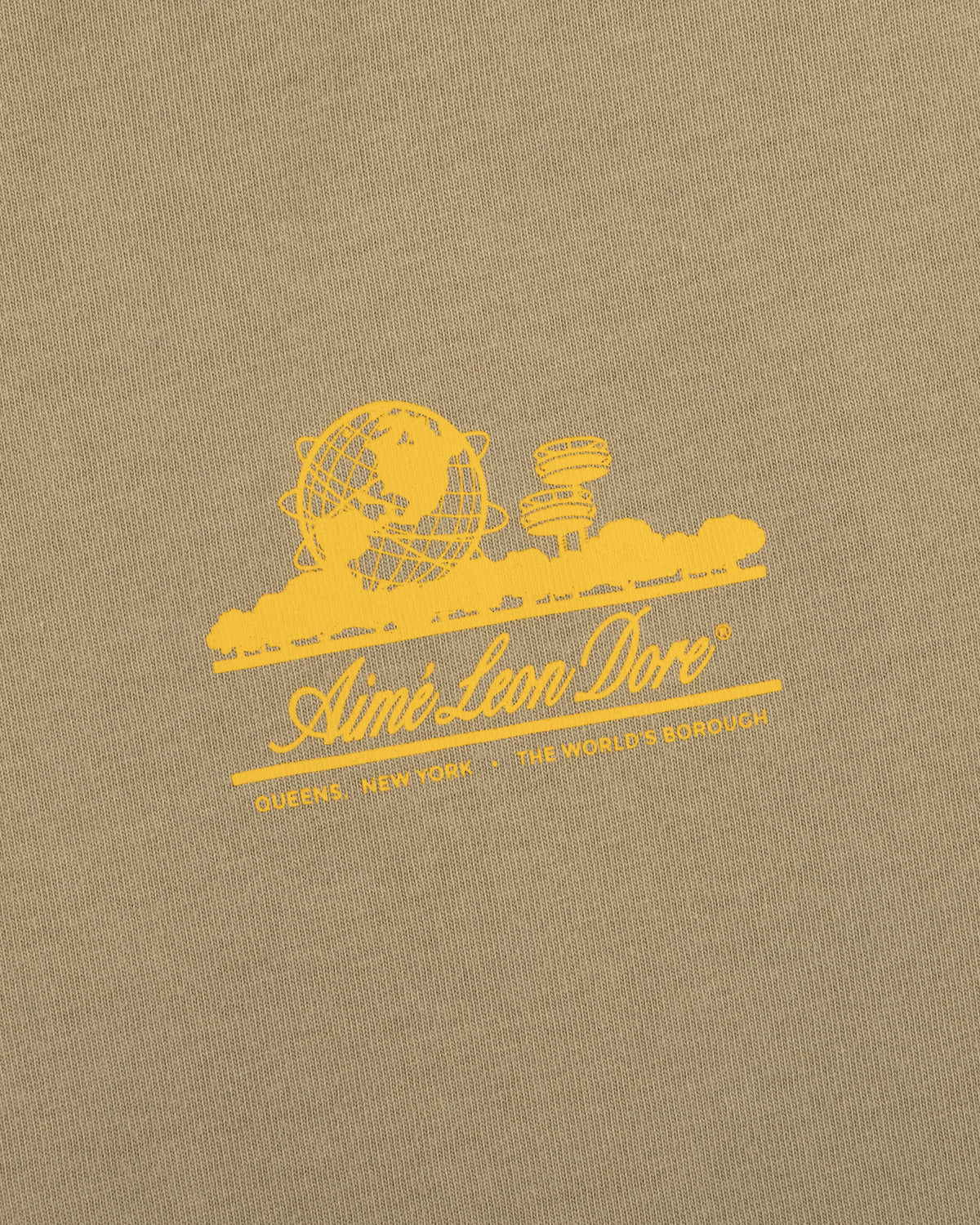 Sun Faded Unisphere Tee: yellow Aimé Leon Dore logo with globe, skyline, and "Queens, New York - The World's Borough.