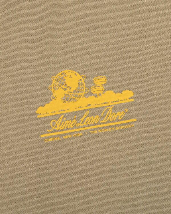 Sun Faded Unisphere Tee: yellow Aimé Leon Dore logo with globe, skyline, and "Queens, New York - The World's Borough.