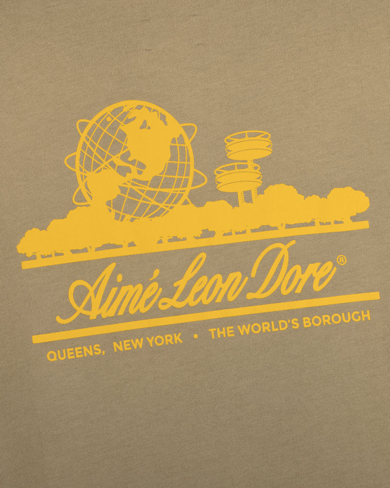 Sun Faded Unisphere Tee featuring a yellow globe, cityscape, and "Aimé Leon Dore, Queens, New York, The Worlds Borough" graphic.