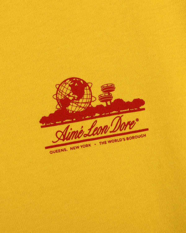 Yellow Sun Faded Unisphere Tee with red globe, skyline, and “Aimé Leon Dore, Queens, New York, The World’s Borough” text.