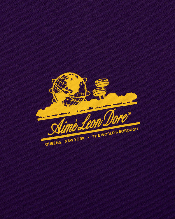 Yellow graphic of the Unisphere and towers with Aimé Leon Dore text on the Sun Faded Unisphere Tee.