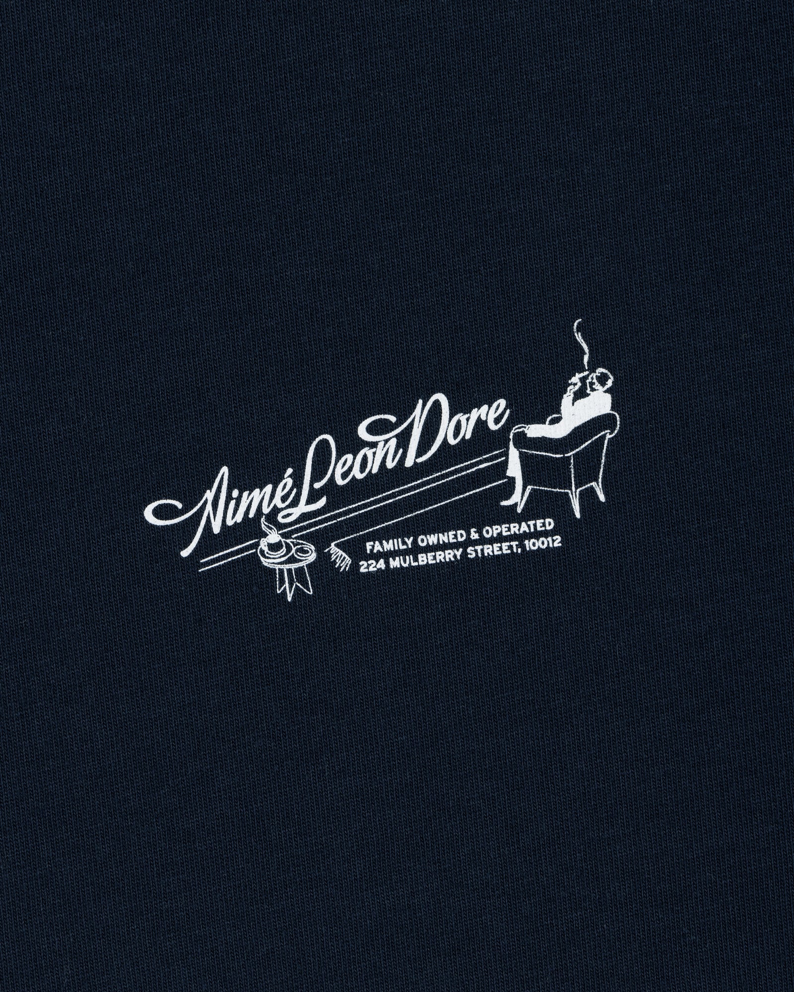 The Pappoús Logo Tee features "Aimé Leon Dore" with a man lounging and address 224 Mulberry Street, 10012 below.