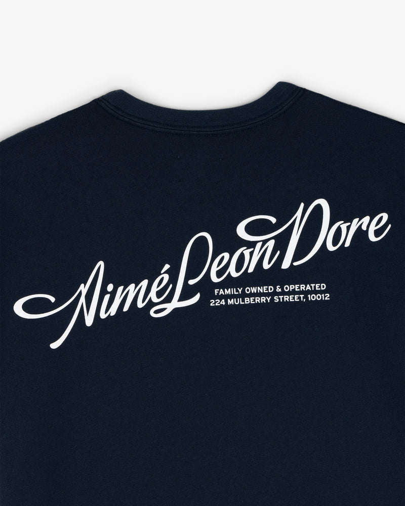 Navy Pappoús Logo Tee with Aimé Leon Dore and Family Owned & Operated, 224 Mulberry St, 10012 in white script.