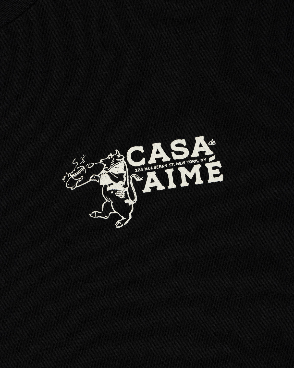 Long-Sleeve Casa Tee: Black with white graphic of a bull holding a rose, “Casa de Aime, 224 Mulberry St. New York, NY.”.