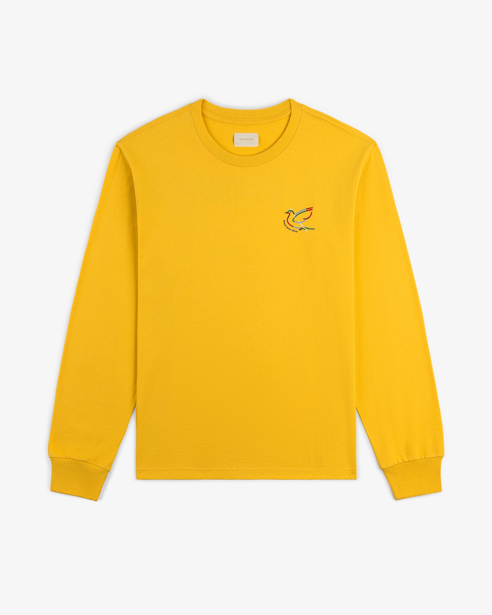 Long-Sleeve Souvenir Tee in yellow with a colorful bird embroidered on the left chest, displayed flat on white.