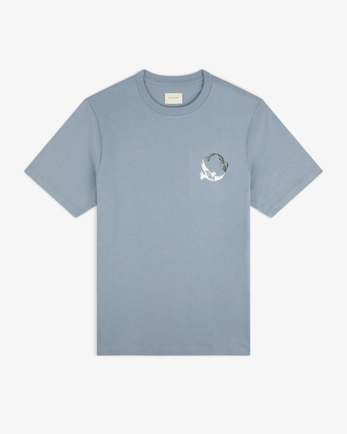 Woodblock Dove Tee: light blue short-sleeve shirt with a white bird and green leaf graphic on the left chest.