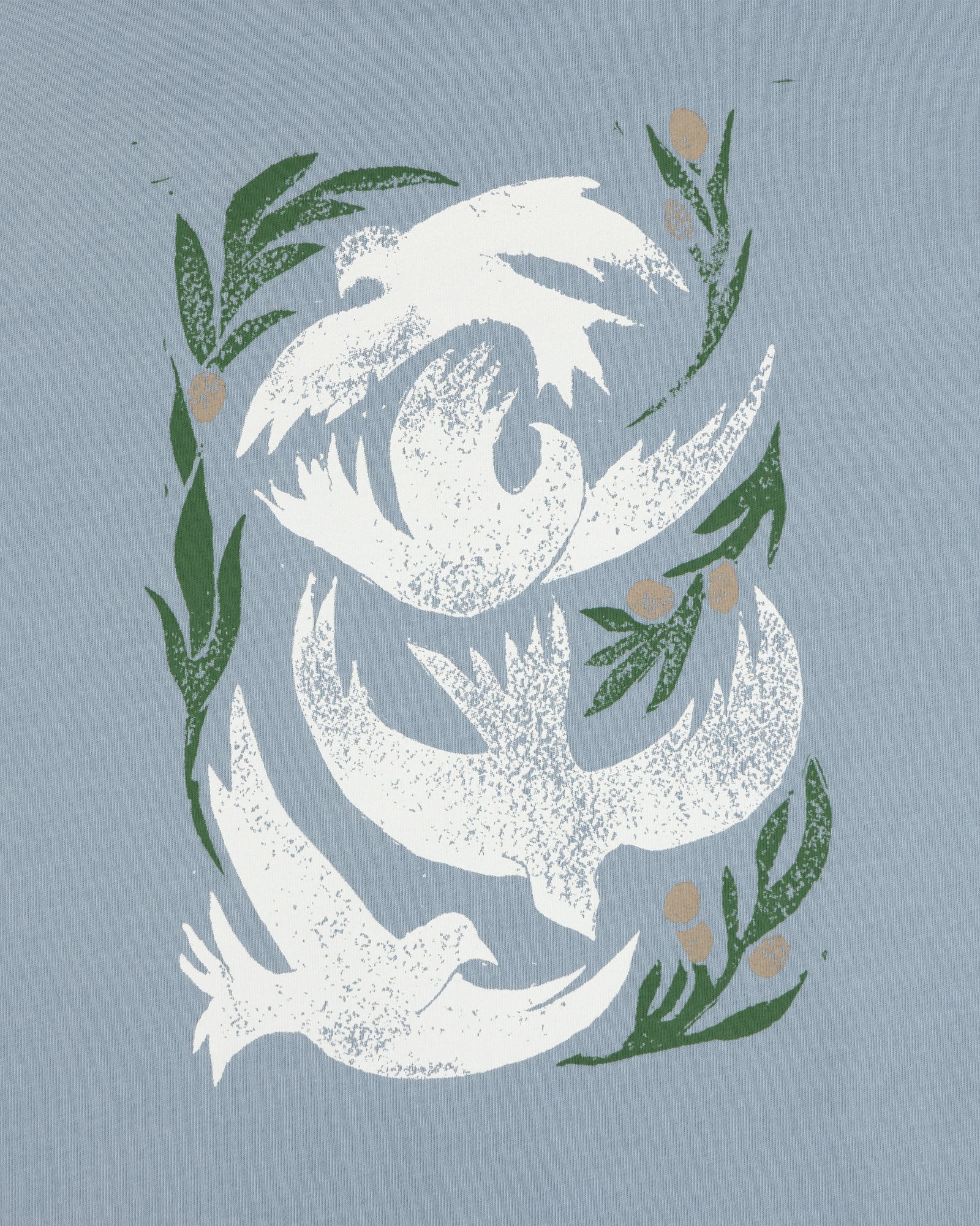 Three white doves with green olive branches on a light blue background, featured on the Woodblock Dove Tee.