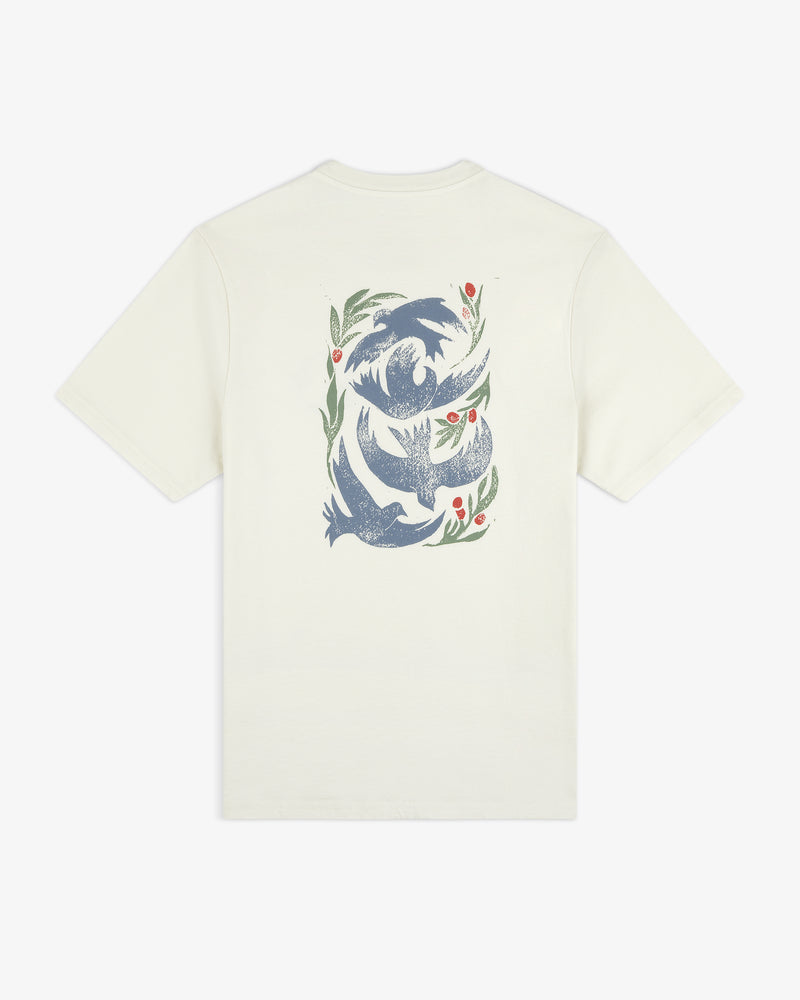 Back of off-white Woodblock Dove Tee with blue birds and green leaves plus red berries in a vertical pattern.