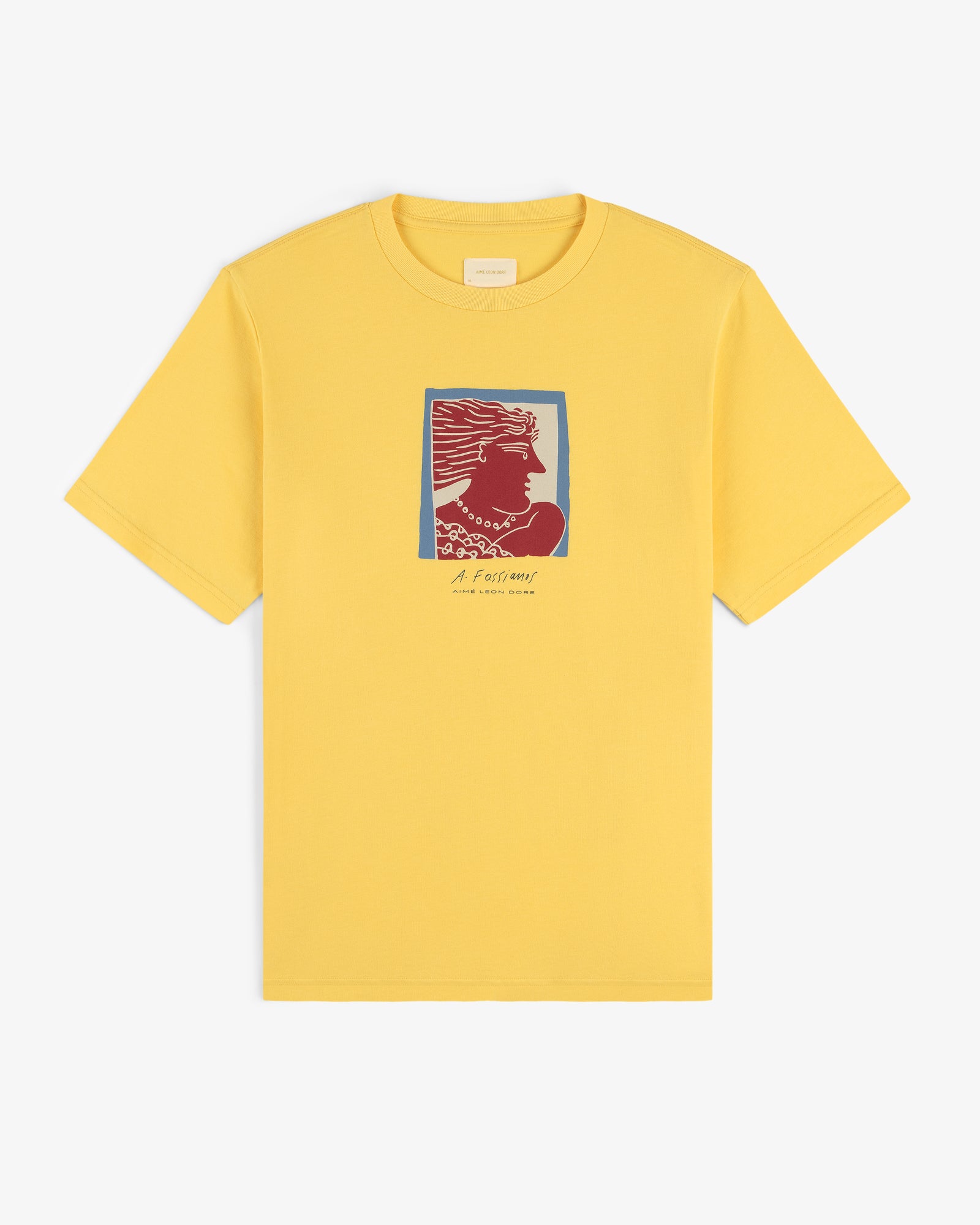 Fassianos Portrait Tee: yellow shirt with a red and blue woman’s profile and small text beneath the chest image.