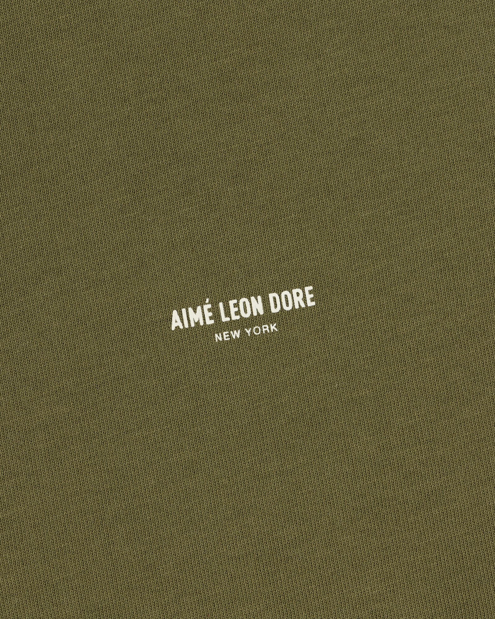 Safari Tee in olive green with AIMÉ LEON DORE NEW YORK printed in small white uppercase letters at the center.
