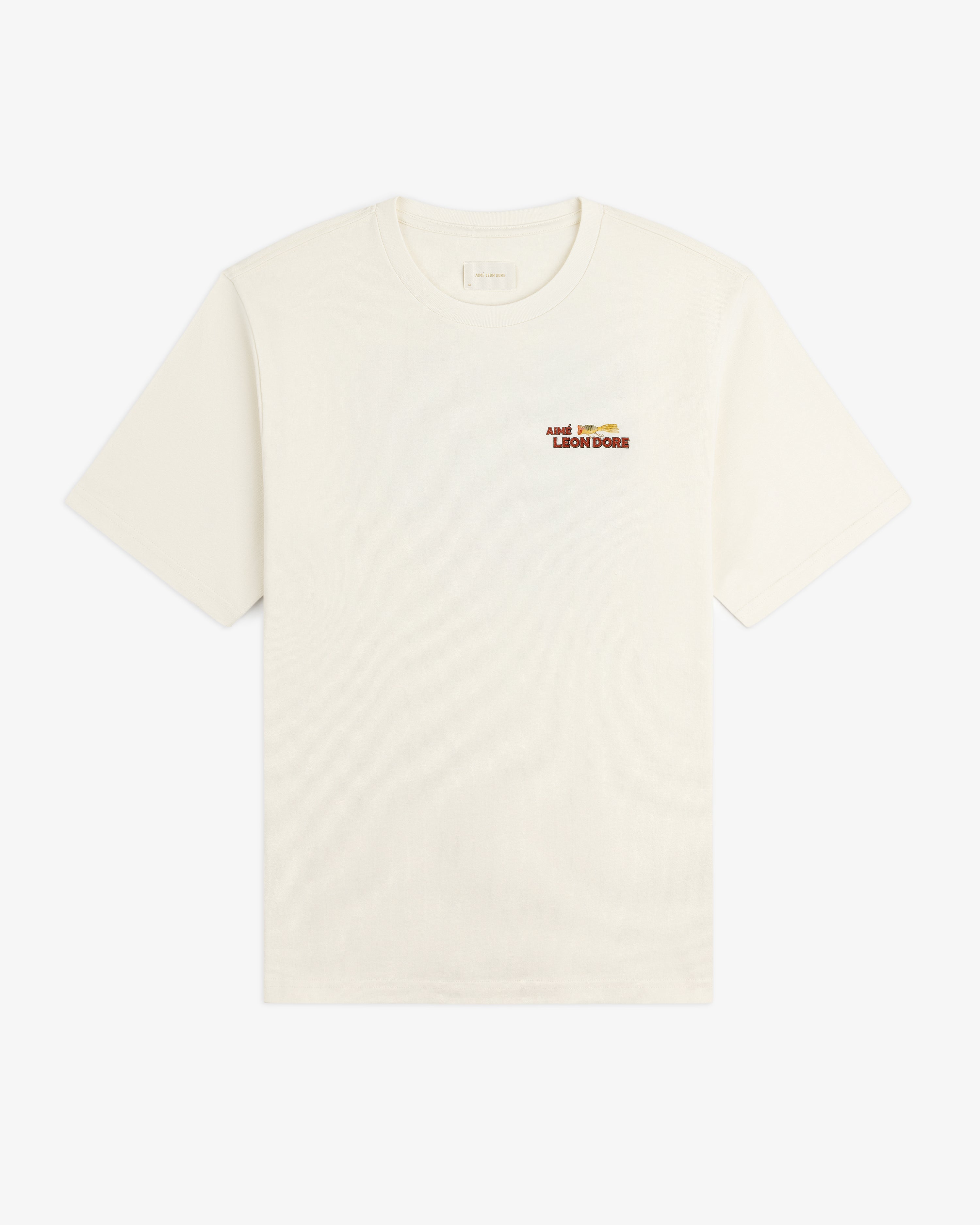 Catch & Release Tee in off-white with small brown and gold Aimé Leon Dore logo on left chest.