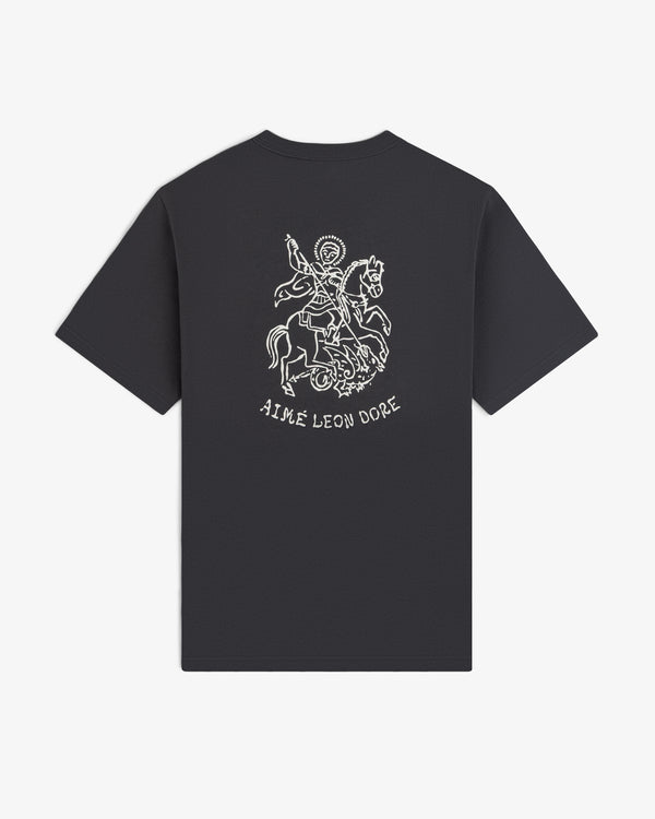 Saint George Graphic Tee: Black t-shirt with a white line drawing of a knight and AIME LEON DORE text on the back.