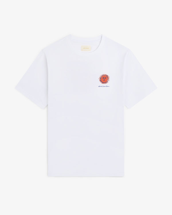 Fassianos "Sovereign Sun" Tee: white t-shirt with small red-orange sun and text on left chest, shown on plain background.