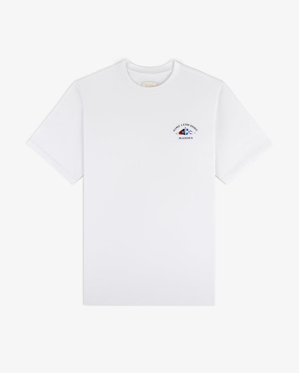 Marina Tee: white short-sleeve shirt with small blue graphic and text on upper left chest.