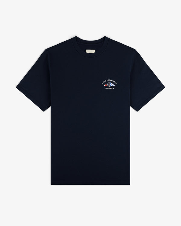 The Marina Tee is a plain black shirt with a small white graphic and text on the left chest, shown on a white background.