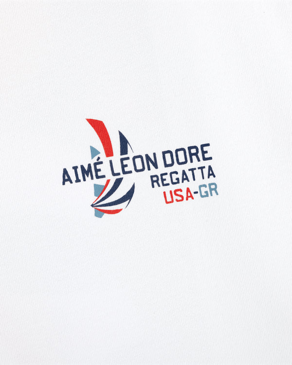 Regatta Tee with Aimé Leon Dore sailboat logo and USA-GR text on a white background.