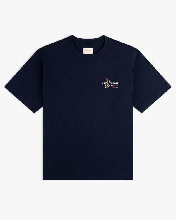 Regatta Tee: Navy blue short-sleeve shirt with a small colorful graphic and text on the left chest.