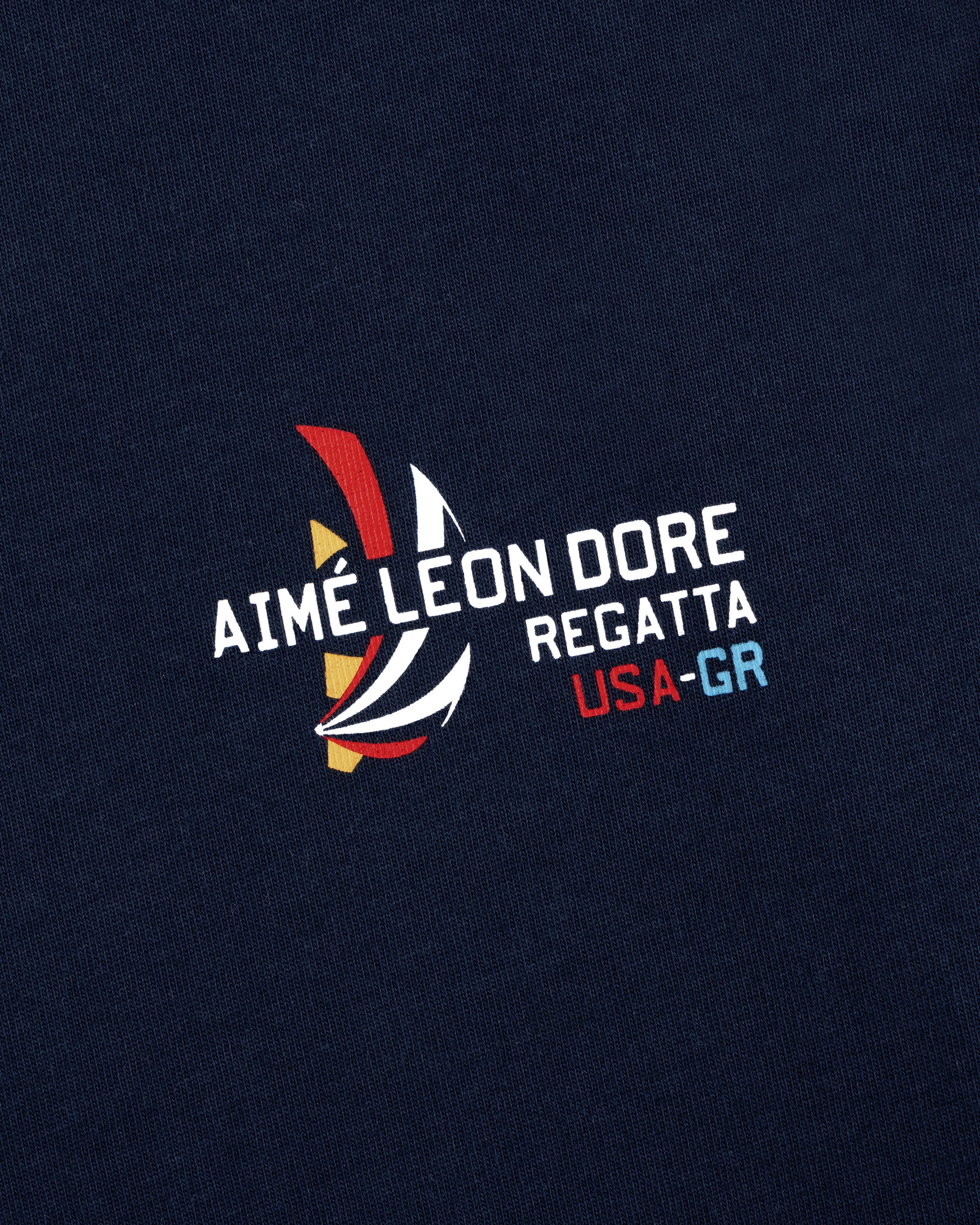 Navy Regatta Tee featuring Aimé Leon Dore USA-GR and a colorful sailboat graphic print.