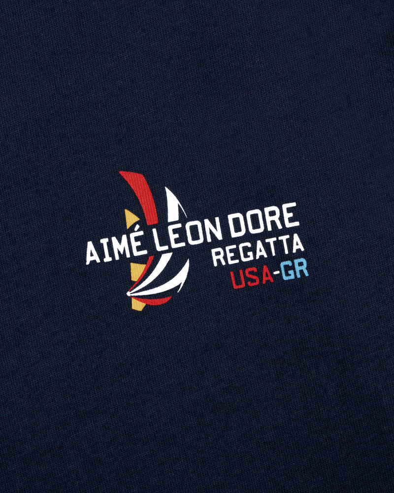 Navy Regatta Tee featuring Aimé Leon Dore USA-GR and a colorful sailboat graphic print.