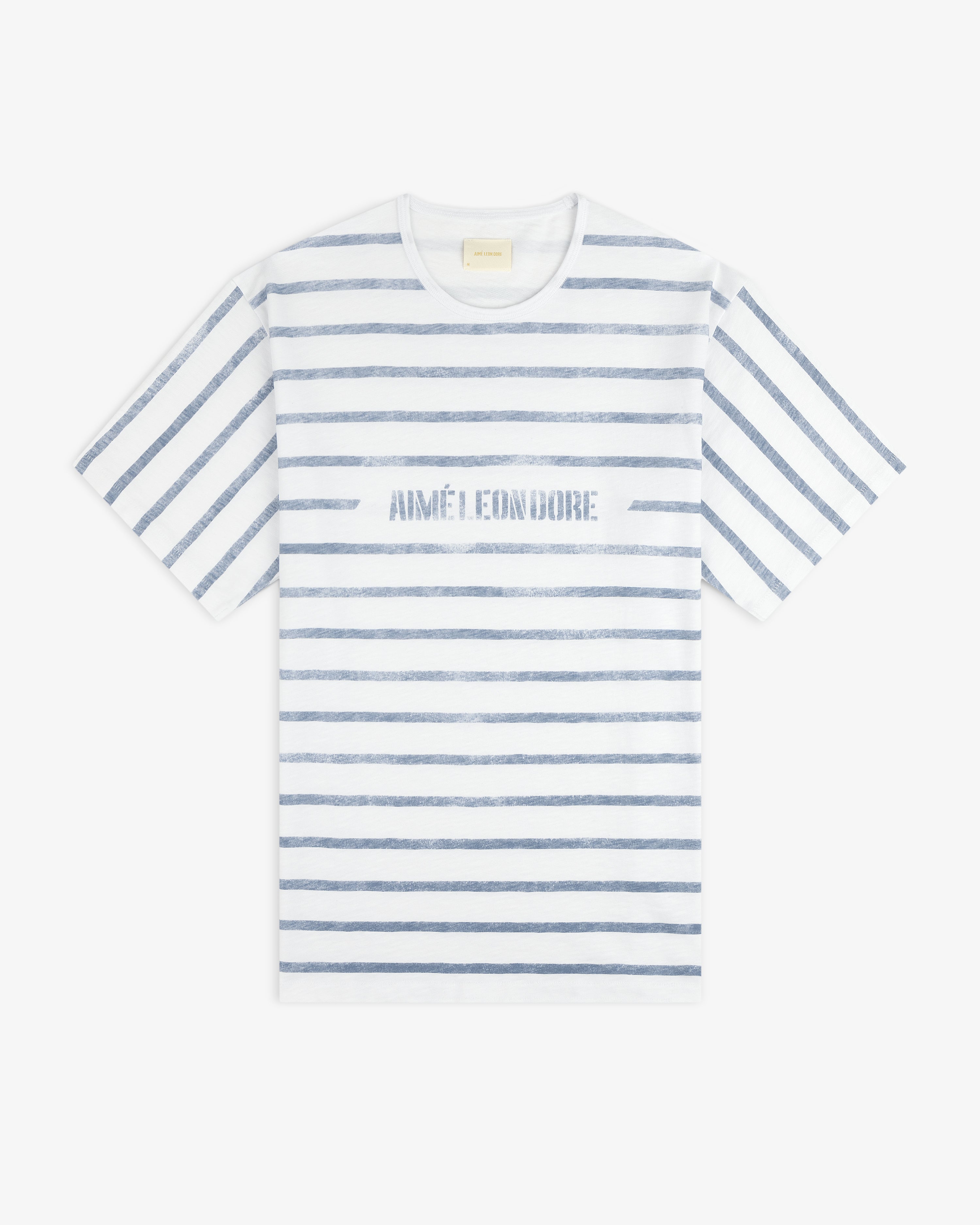 Slub Beach Tee: White T-shirt with blue stripes and AIMÉ LEON DORE text across the chest.