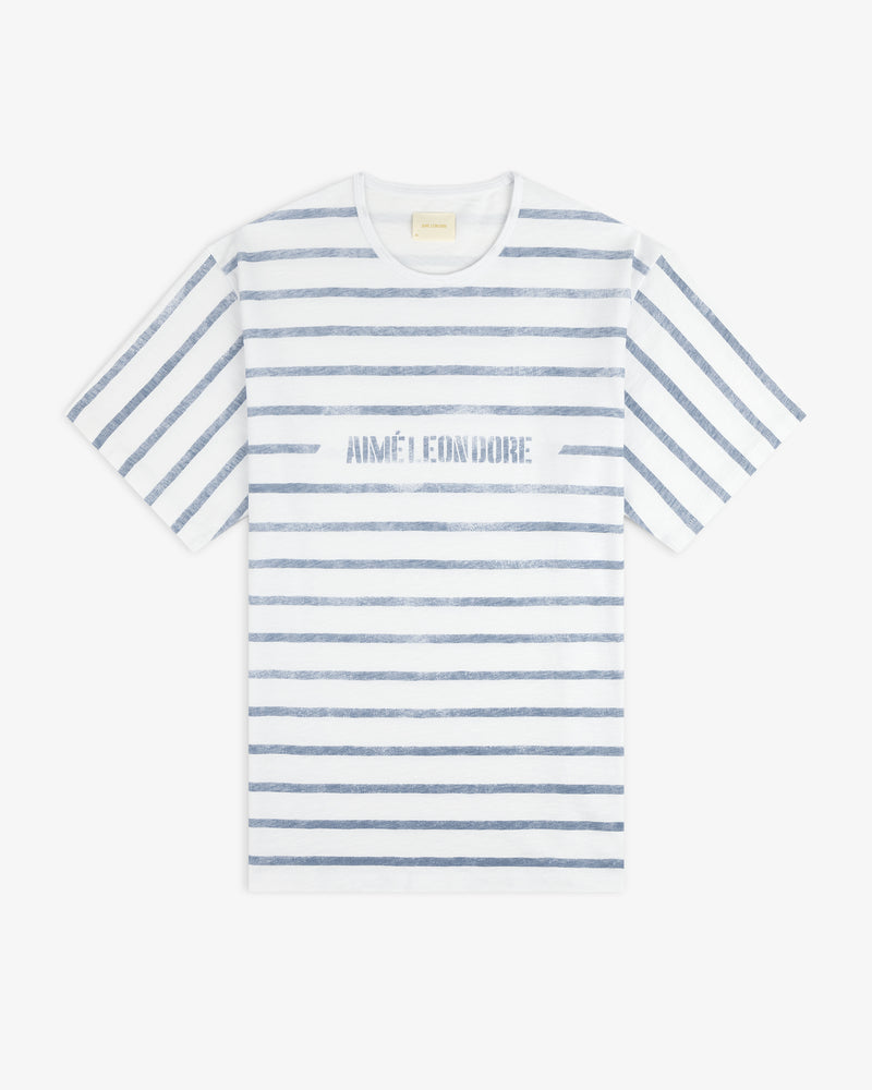 Slub Beach Tee: White T-shirt with blue stripes and AIMÉ LEON DORE text across the chest.