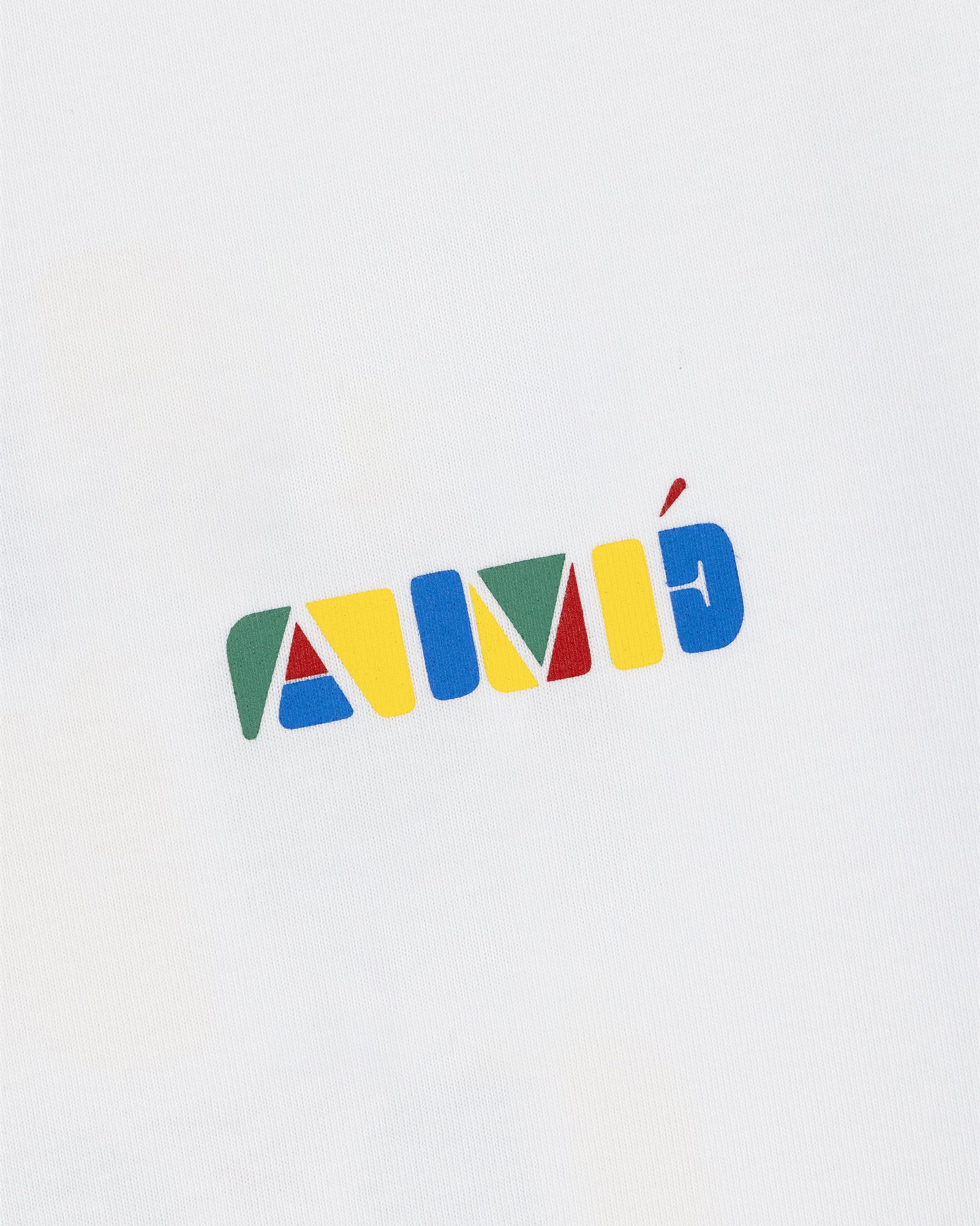 Stacked Logo Tee featuring colorful geometric letters spelling AMÉ on a white background.
