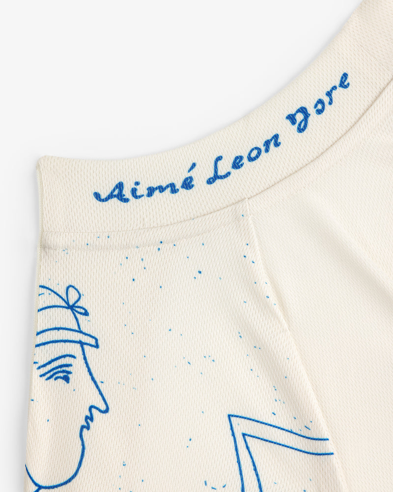 Close-up of cream-colored Fassianos Half-Zip Cycling Jersey with blue line art and Aimé Leon Dore text on the waistband.