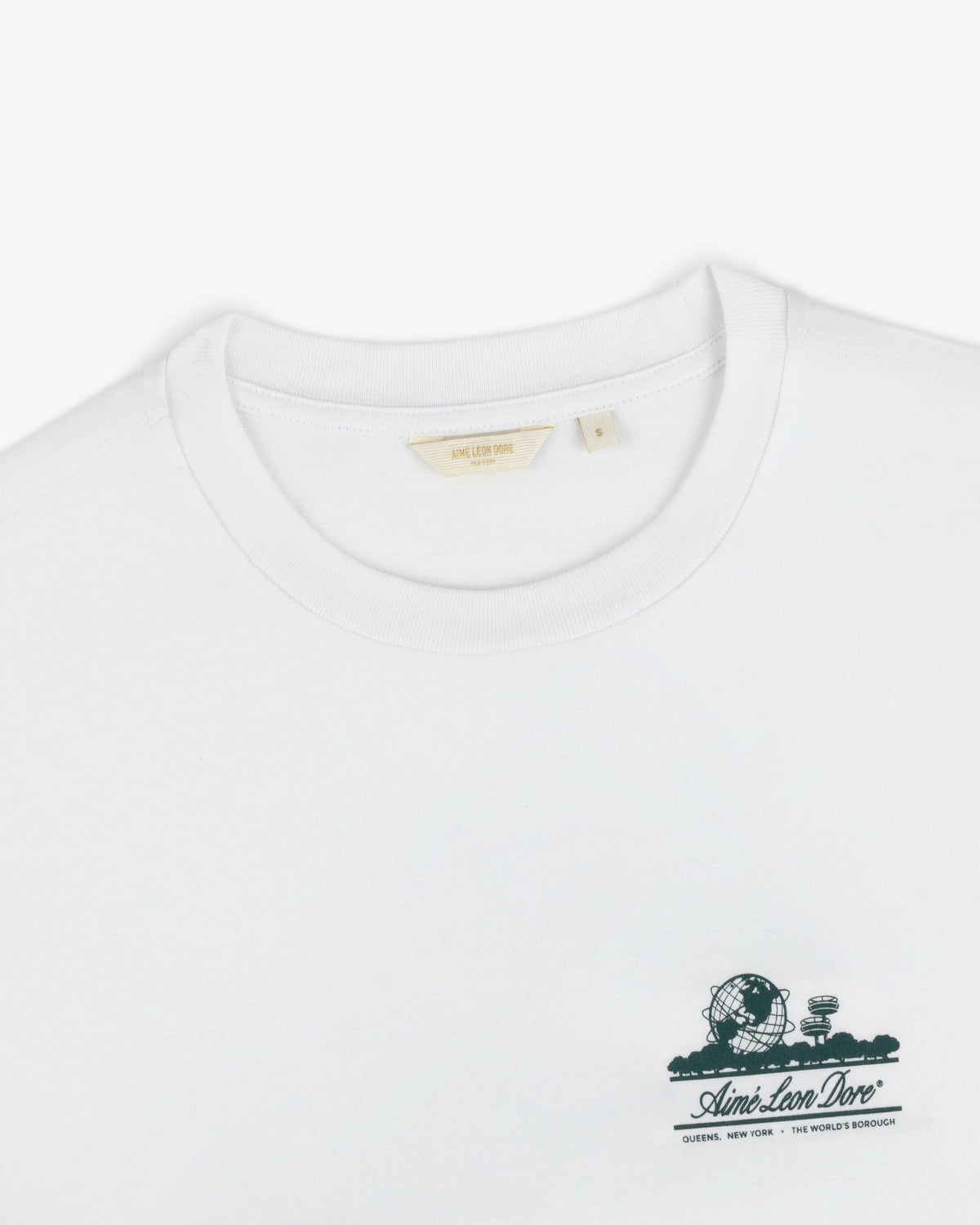 Cropped Aloe-Blend Unisphere Tee with a small green logo and graphic on the left chest.