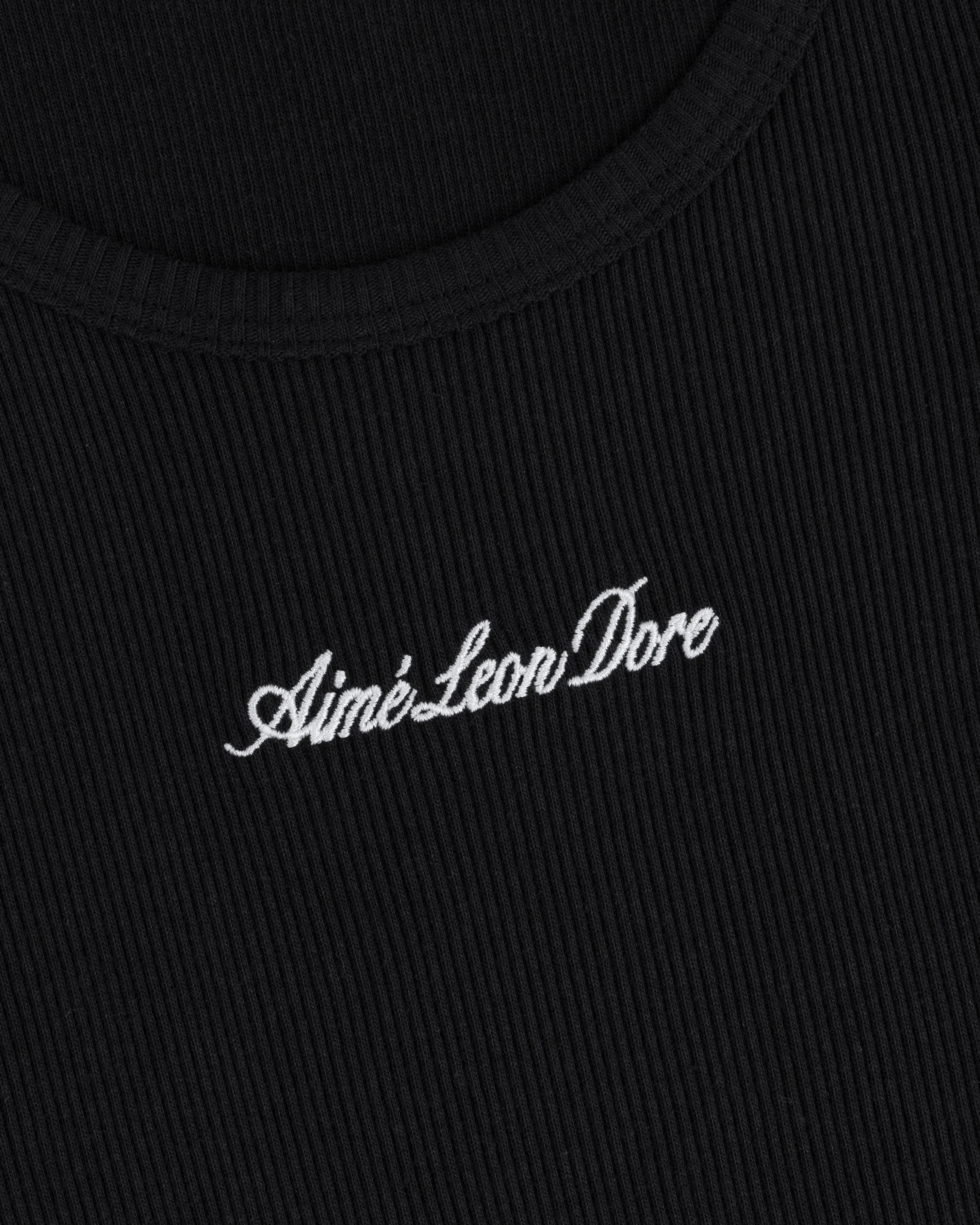 Close-up of black ribbed Embroidered Logo Tank Top with Aimé Leon Dore in white cursive text.