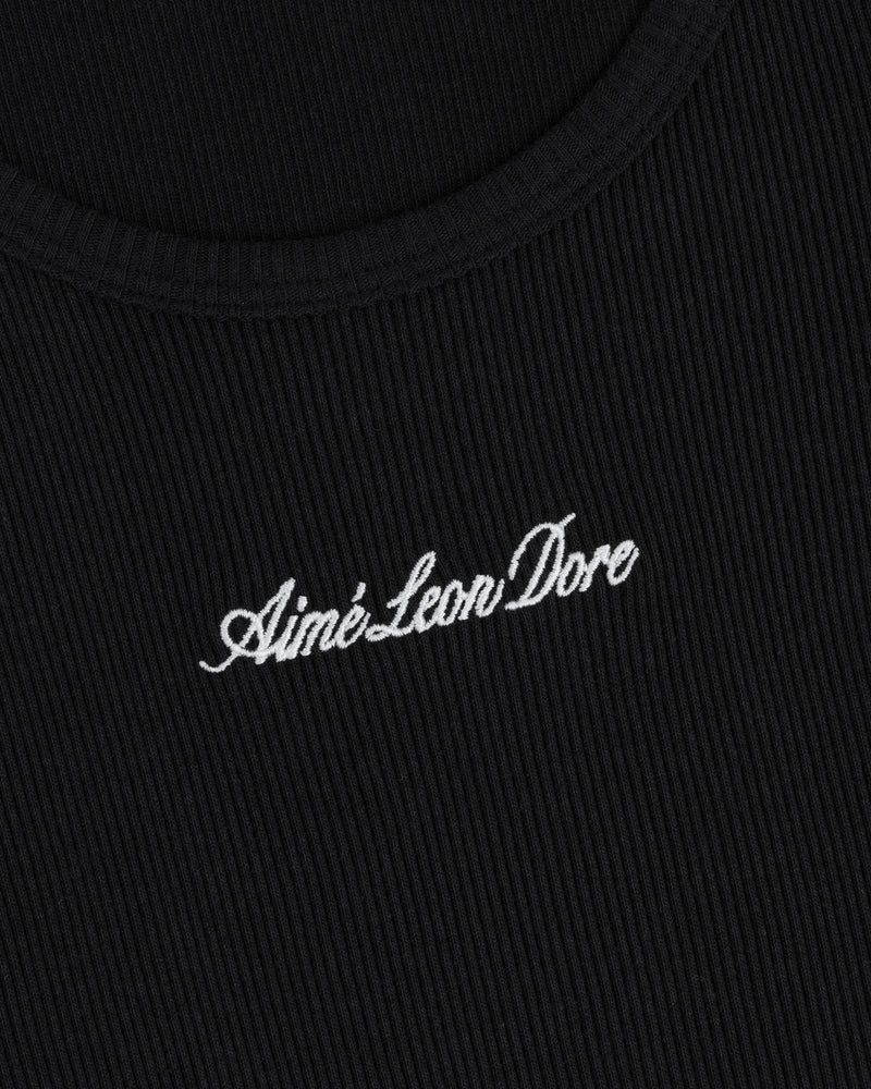 Close-up of black ribbed Embroidered Logo Tank Top with Aimé Leon Dore in white cursive text.