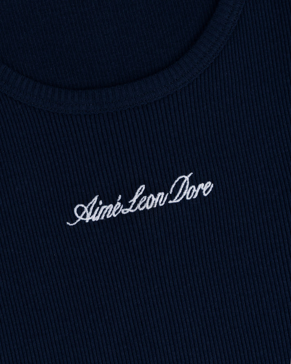 Close-up of navy ribbed fabric on the Embroidered Logo Tank Top with white Aimé Leon Dore cursive embroidery.