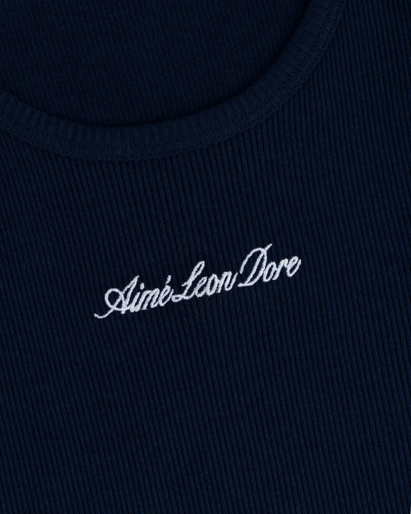 Close-up of navy ribbed fabric on the Embroidered Logo Tank Top with white Aimé Leon Dore cursive embroidery.
