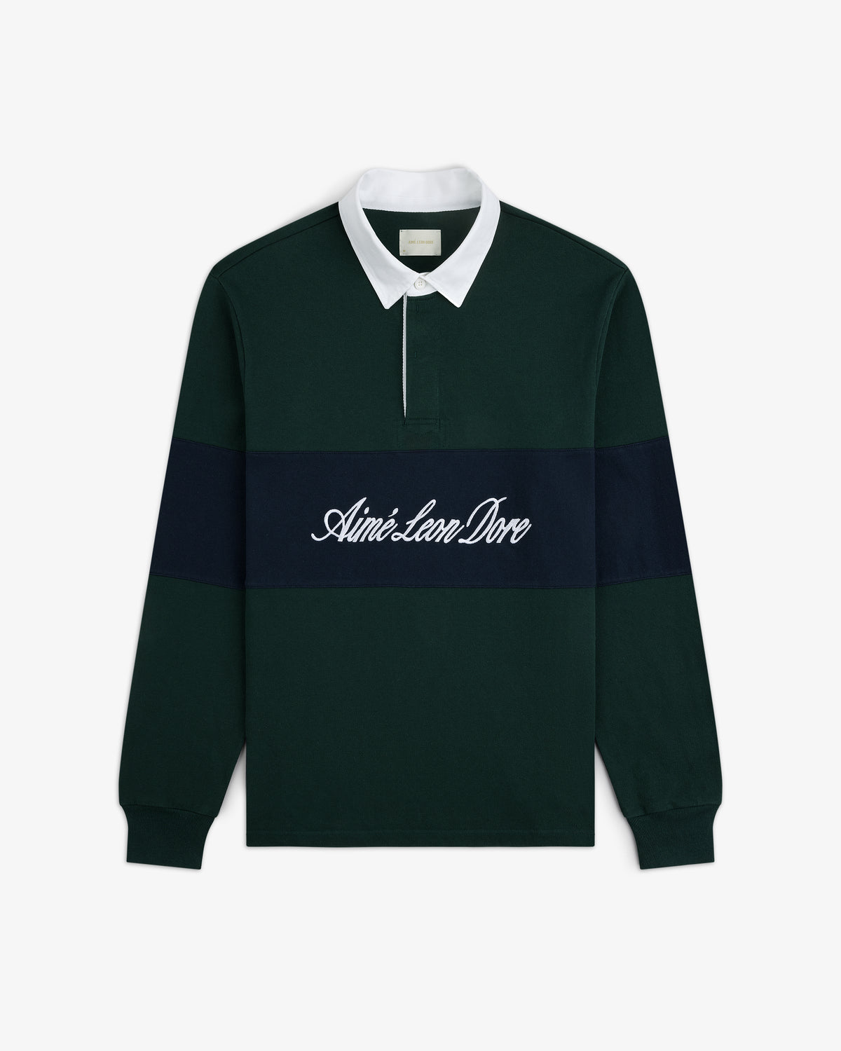 Script Paneled Rugby: green shirt with white collar, navy chest stripe, and Aimé Leon Dore script.